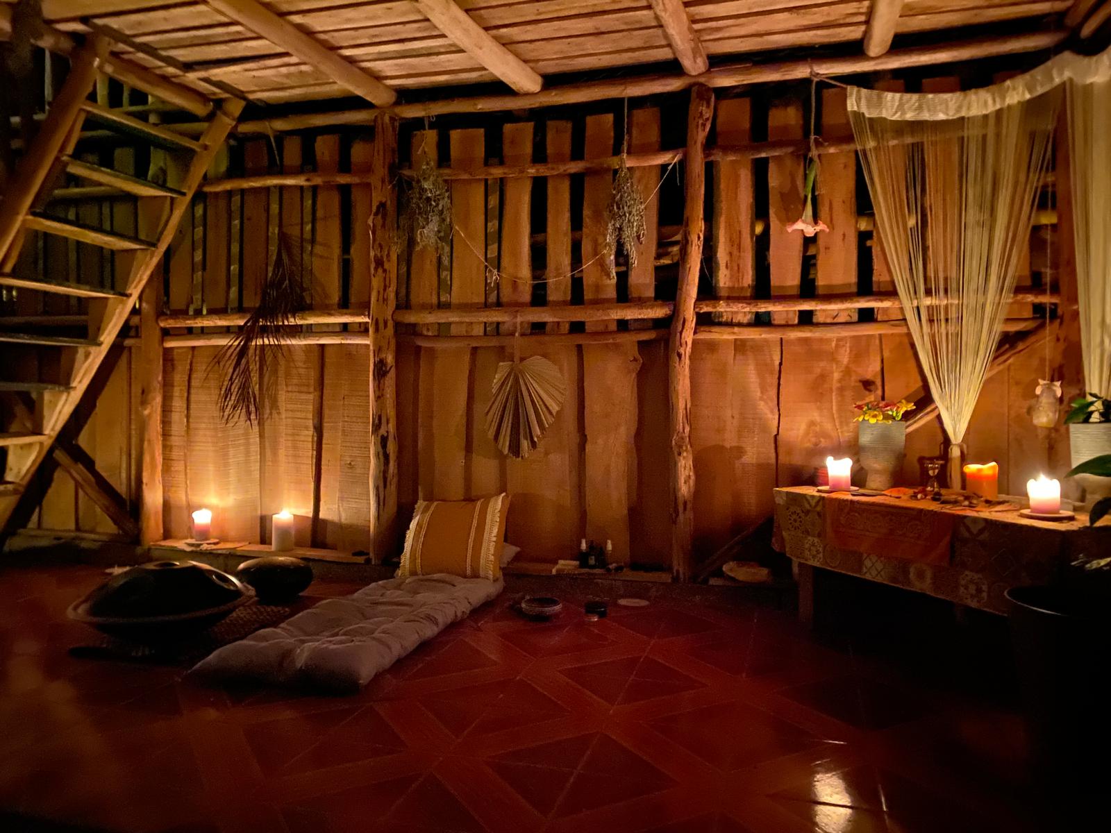 Private retreat space with candlelight in a rustic wooden house at Lian House Costa Rica